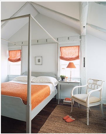Hits of orange in the bedroom.