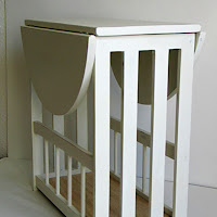 Side view of magazine table with top folded down