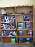 One of the bookshelves in the Mahlahluvana library, with many of the Art Club sculptures proudly displayed. South Africa - 478.jpg