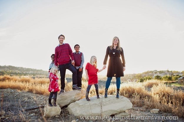 family on rocks posing backlit (Medium)