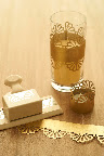 Gorgeous cylinders from Save-on-Crafts.com create simple decor for your table. Punch your paper and place around each cylinder. You can also attach your punched paper to pillar candles with a piece of double stick tape. (Gold paper for cylinders, napkin rings, and votive wraps from http://www.paper-source.com/) Gorgeous cylinders from Save-on-Crafts.com create simple decor for your table. Punch your paper and place around each cylinder. You can also attach your punched paper to pillar candles with a piece of double stick tape. (Gold paper for cylinders, napkin rings, and votive wraps from http://www.paper-source.com/)