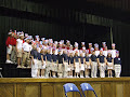 Lower and middle school student "buddies" gathered at the Veterans Day Assembly to honor all who serve our country. Student Council officers Herrington Murray and Mollie Moses led the program which featured the National Anthem sung by sixth grader Tori Williams, a song by the second grade, readings by the fifth grade, and the address by Colonel Jack Bryant.