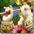 [Krishna holding His flute]