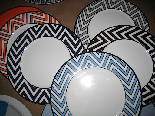 Some Mikasa Color Studio plates in orange, navy, blue, brown, and grey. We loved the geometric pattern.