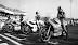 POSTO IN PRIMA FILA: Un’altra prima fila del 1976, questa volta tra due campioni del mondo: Johnny Cecotto su Yamaha e Giacomo Agostini su una Suzuki RG come la mia. In primo piano c’è  Virginio Ferrari, e siamo a Misano dove  si correva anche troppo spesso. A me, per dirla tutta, la pista garbava poco.