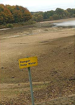 A sign at a dried-up lake in Britain reads 'Danger Deep Water', 7 May 2011. This year has seen an unusually dry spring, and despite some recent rainfall the dry weather is set to continue across much of the country into June, leaving rivers, streams, ponds and lakes all low on water in some areas. news.bbc.co.uk