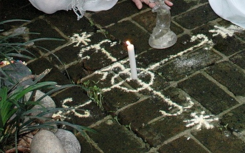 A wedding veve (religious Voodoo symbol) made with powder. A wedding veve (religious Voodoo symbol) made with powder.