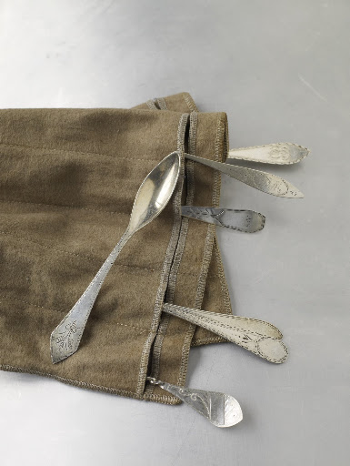 The designs on these slender Georgian silver teaspoons from the late 18th century are confined to the hands and edges.