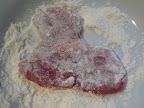 Dredge pork first in flour.