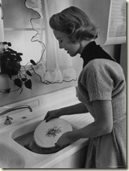 1960s 1950s SMILING MAN HUSBAND IN APRON WASHING AND DRYING DISHES IN  KITCHEN - s10163c DEB001 HARS OLD FASHION 1 TOWEL DISH ASSISTANT LIFESTYLE  STUDIO SHOT HOME LIFE COPY SPACE HALF-LENGTH DRY