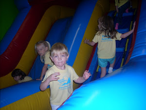 Getting ready to go up the big blue slide!