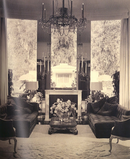 James Pendleton bought many of the furnishings for his house from Tony Duquette. Over the living room's mantelpiece, a window overlooking the pool house replaces the conventional mirror over the fireplace. (Regency Redux, Rizzoli)