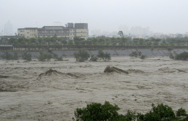 A flooded river is seen after Typhoon Soulik hit Miaoli County, central Taiwan, 13 July 2013. Typhoon Soulik brought powerful winds and heavy rain as it landed in Taiwan early Saturday, killing two and injuring 54. At least 295 people have been confirmed dead or missing after rainstorms and Typhoon Soulik hit China, causing floods, landslides and buildings to collapse. Photo: India Times