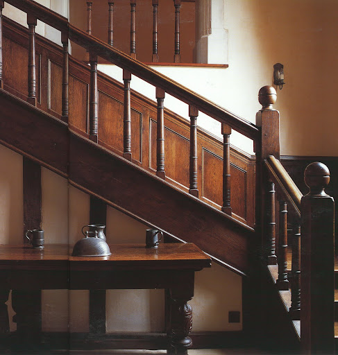 A restored farm house is now home to a family of six, dedicated to horses. An Elizabethan table stands in front of a Jacobean staircase.