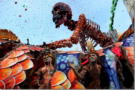 Dancers perform on a float during the parade of the Mancha Verde samba school in Sao Paulo. (Andre Penner/Associated Press)