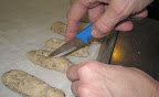 I learned that it's important to slash narrow rolls and baguettes to help the bread hold its shape in oven.