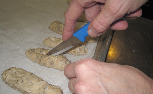 I learned that it's important to slash narrow rolls and baguettes to help the bread hold its shape in oven. I learned that it's important to slash narrow rolls and baguettes to help the bread hold its shape in oven.