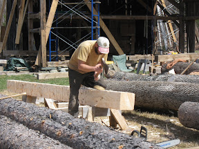 Michael hews the new post timber.