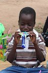 Workmen’s children enjoying Christmas Party gifts