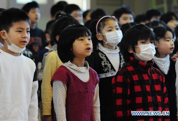 Students attend the opening ceremony of new semester at the elementary school in Fukushima, Japan, April 6, 2011. Most of the schools began their regular classes on Wednesday in the city of Fukushima. Ji Chunpeng / Xinhua