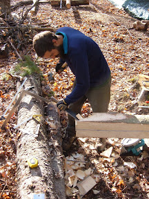 Michael cuts the joinery on the foot of a new rafter.