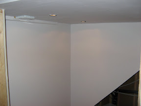 under the stairs, primed.