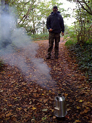 Gathering more fuel - once the pine sticks had gotten it started, there's enough heat in it to use any fuel off the ground even if it's damp.
