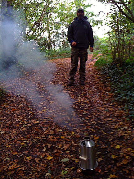 Gathering more fuel - once the pine sticks had gotten it started, there's enough heat in it to use any fuel off the ground even if it's damp.