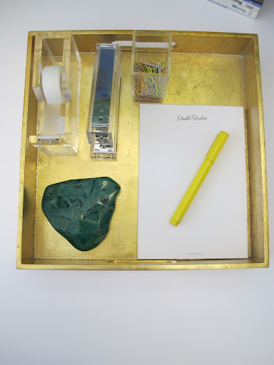 I use the piece of malachite as a paper weight. The yellow pen makes taking notes fun.