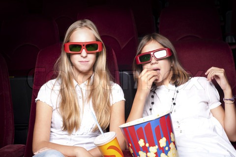 [2446900-56428-two-girls-look-three-dimensional-cinema-sitting-in-the-glasses-eat-popcorn-drink-drink%255B4%255D.jpg]