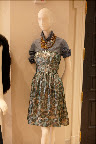 A great strapless dress is paired with a jean shirt and a fantastic necklace. A great strapless dress is paired with a jean shirt and a fantastic necklace.