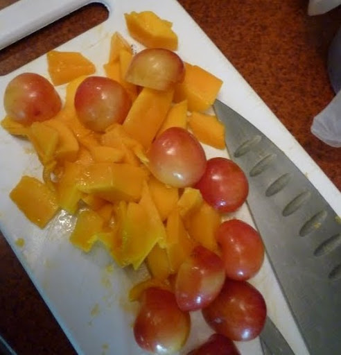 After slicing the rest of the mango, Steve carefully pitted  and sliced cherries.