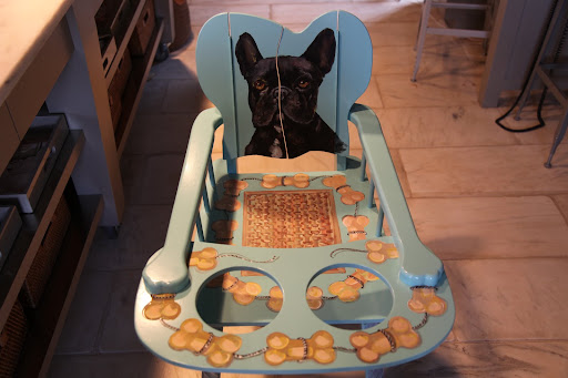 It's a very fancy highchair with my portrait painted on it.