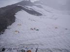 Alpine Ascents clients working on traversing and arrest skills above the tents.
