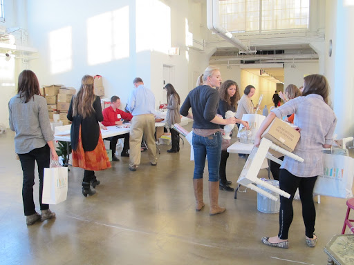 Everybody checking out with their purchases! One stop shopping during the workday never hurt anyone.
