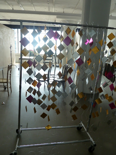 We strung the garlands on a garment rack as we made them so they wouldn't get tangled.