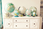 Vintage globes, in a beachy, sun-faded palette, were used for the escort-card display. Vintage globes, in a beachy, sun-faded palette, were used for the escort-card display.