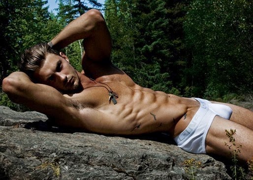 Sexy Guy Lying on a Rock