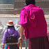 Monk and a woman outside of Lablang Monastery, Gansu.