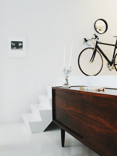 Here, the bike has become a coordinating piece along with the mirror and the black and white photography. (Daniel Hertzell)