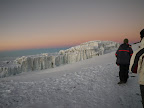 Finally enough light to see the ice. Summit ridge, Kilimanjaro.