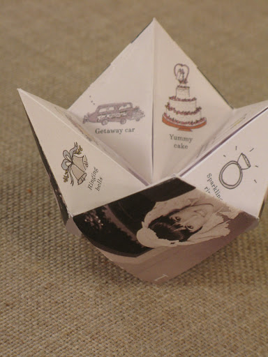 Blackandwhite wedding photos decorated the outside of the cootie catchers