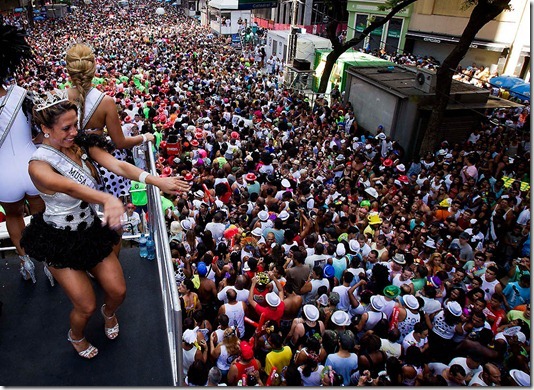 Revelers attend the Cordao da Bola Preta carnival parade in downtown Rio de Janeiro. Thousands of people gathered Saturday to march with one of Rio's most popular and traditional blocos ,or parade groups, created in the early 1900's and believed to be named for a beautiful woman in a black and white polka-dress. (Victor R. Caivano/Associated Press)