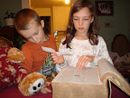 Not satisified with using the paperback dictionary, the kids resort to their great grandfather's unabridged dictionary.