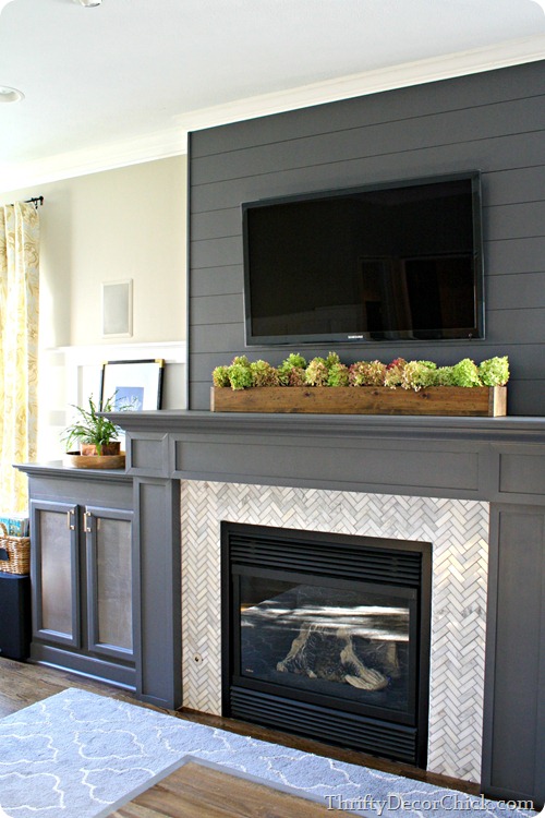 gray fireplace planked wall herringbone tile