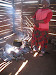 Food preparation at Langeni NCP. Food is one of the major services offered to OVCs, given the improbability that some will be fed when they leave in the afternoon.