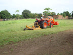 Tractor and slasher mowing the property for the first time