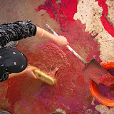 Cleaning up blood after slaughtering a ram in a courtyard on Eid Kbir, one of the Muslim holy days.