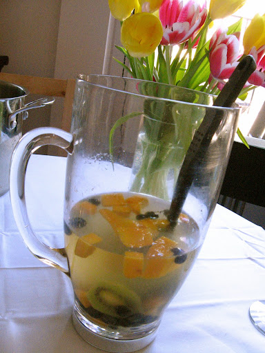 Prosecco punch with mangoes, blueberries, and kiwi.