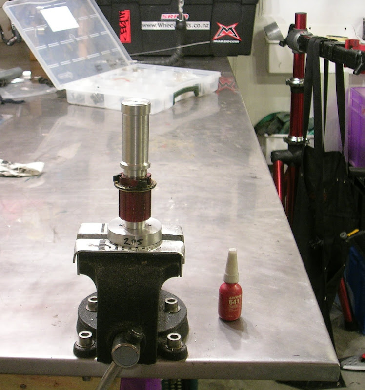The driver fitted on top.  The top of the driver is gently tapped with a soft-faced hammer